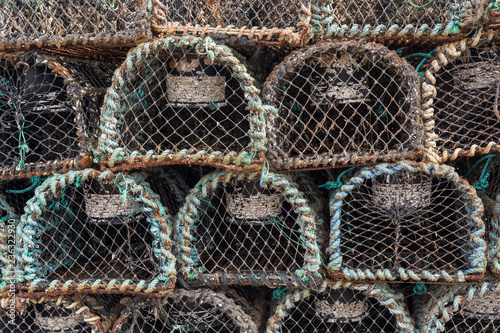 Closeup old stacked traps for lobster and crab fishing, Dingle, Ireland