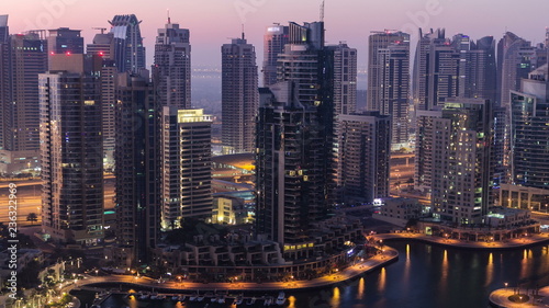 Dubai marina harbor from night to day transition timelapse close view