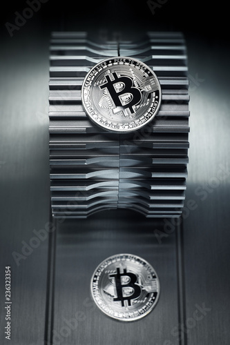 Bitcoin Silver coin lies on the gearwheel. photo