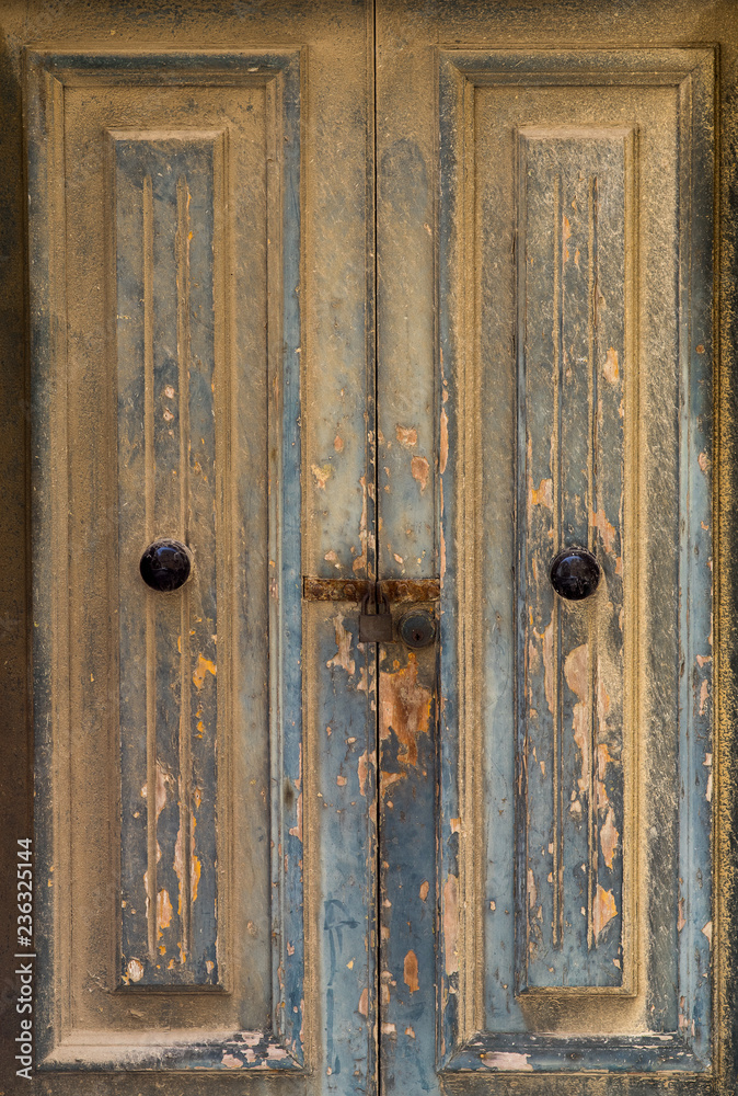 Yellow door with paint in Valletta, Malta