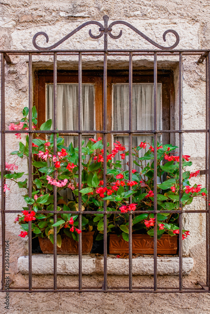 Old stone building with wooden shutters - Mediterranean architecture