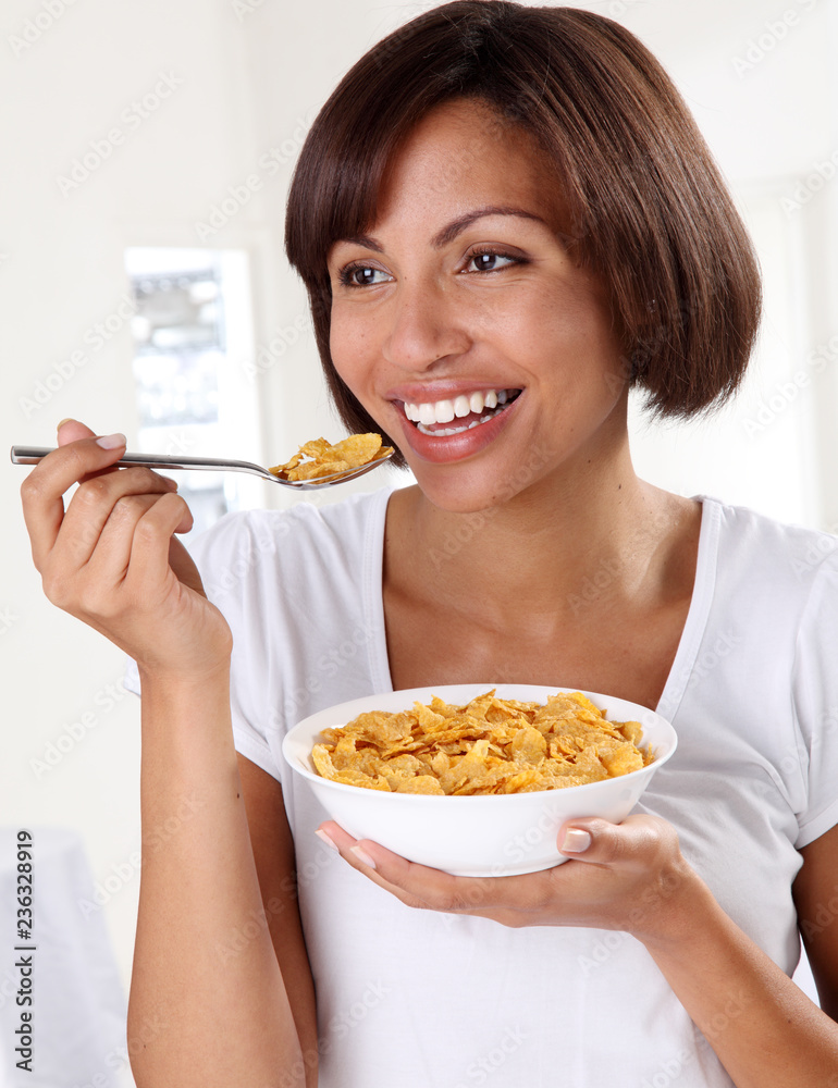 WOMAN EATING CORNFLAKES WOMAN EATING CORNFLAKES