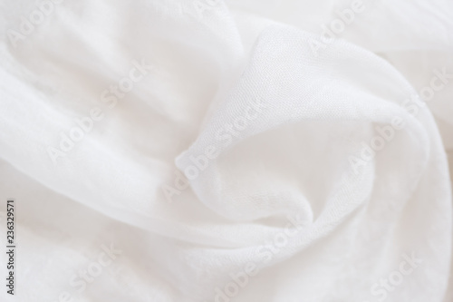 White wrinkled old viscose silk. Thin tissue. random air folds. Viscose silk fabric texture background.