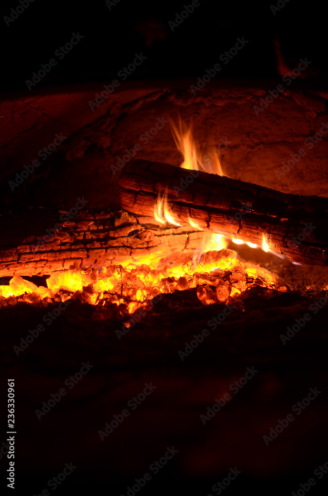 large logs burning in the oven large logs burning in the oven