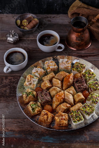 Baklava and delights on silver tray with coffee
