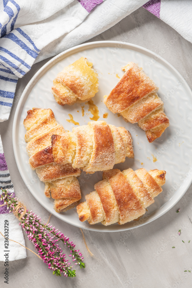 Tasty buttery croissants on plates Tasty buttery croissants on plates