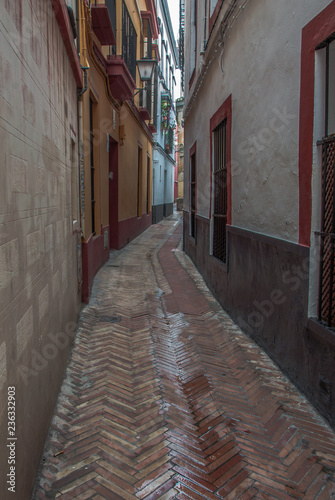 narrow street in old town of seville spain