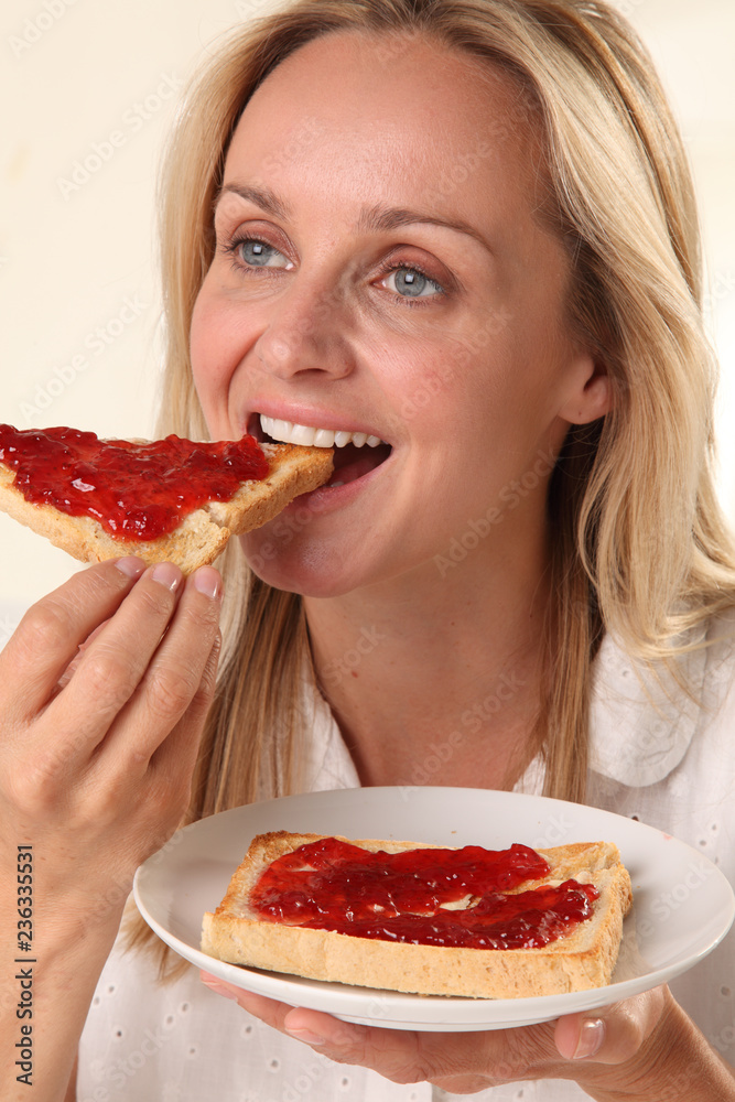 WOMAN EATING TOAST WOMAN EATING TOAST