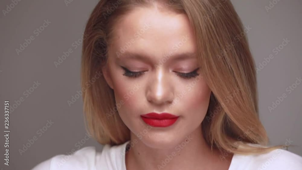 Makeup artist applies lipstick Makeup artist applies lipstick