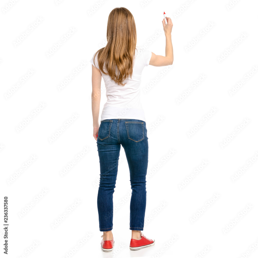 Woman in jeans and t-shirt showing marker in hand on white background isolation back view Woman in jeans and t-shirt showing marker in hand on white background isolation back view
