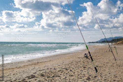 Fishing rods on a sandy beach