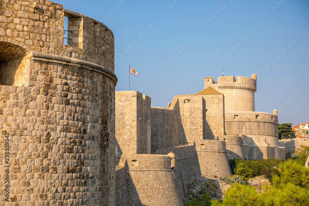 Minceta Tower and Dubrovnik medieval old town city walls at sunset time, Croatia Minceta Tower and Dubrovnik medieval old town city walls at sunset time, Croatia