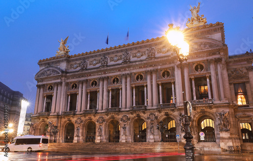 Night front view of the Opera National de Paris. Grand Opera is famous neo-baroque building in Paris.