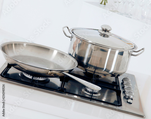 POT AND FRYING PAN ON COOKER HOB