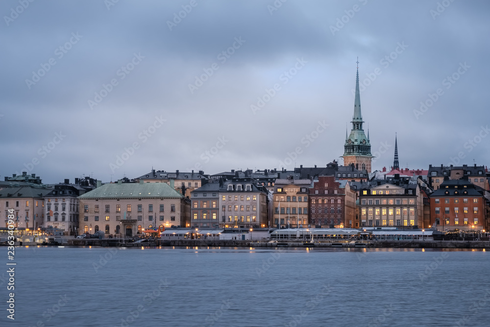 Cityscape of Gamla Stan in Stockholm, Sweden, at sunset. Old city of Stockholm at sunset during blue hour.