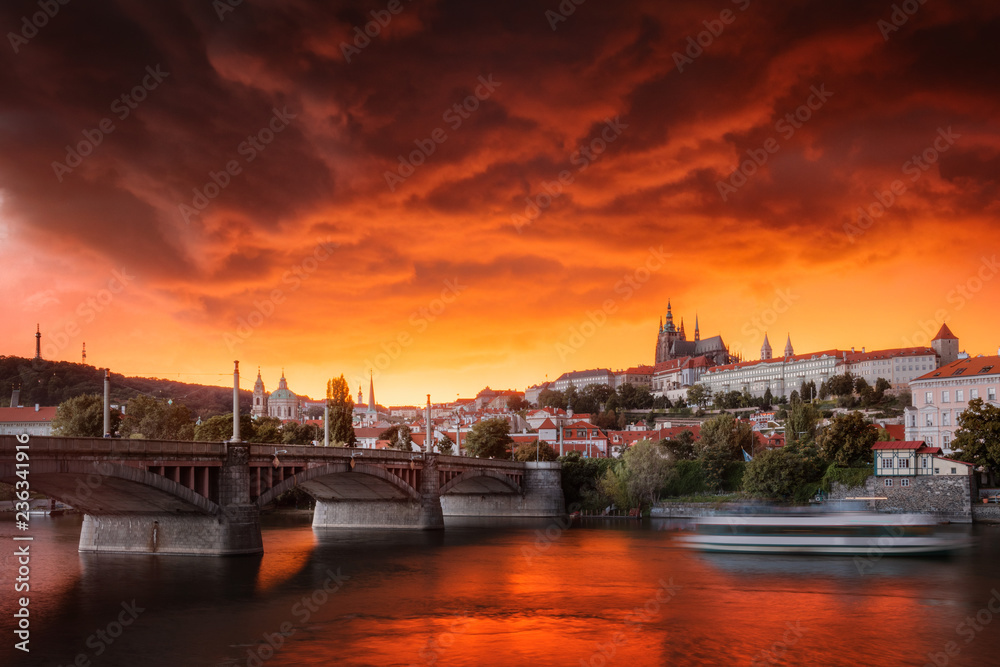 Typical Prague panorama of castle and manes bridge in Czech Republic at the beautiful stormy sunset.
