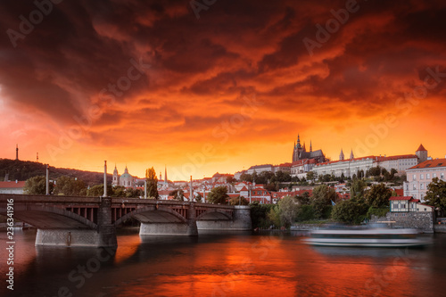 Typical Prague panorama of castle and manes bridge in Czech Republic at the beautiful stormy sunset.