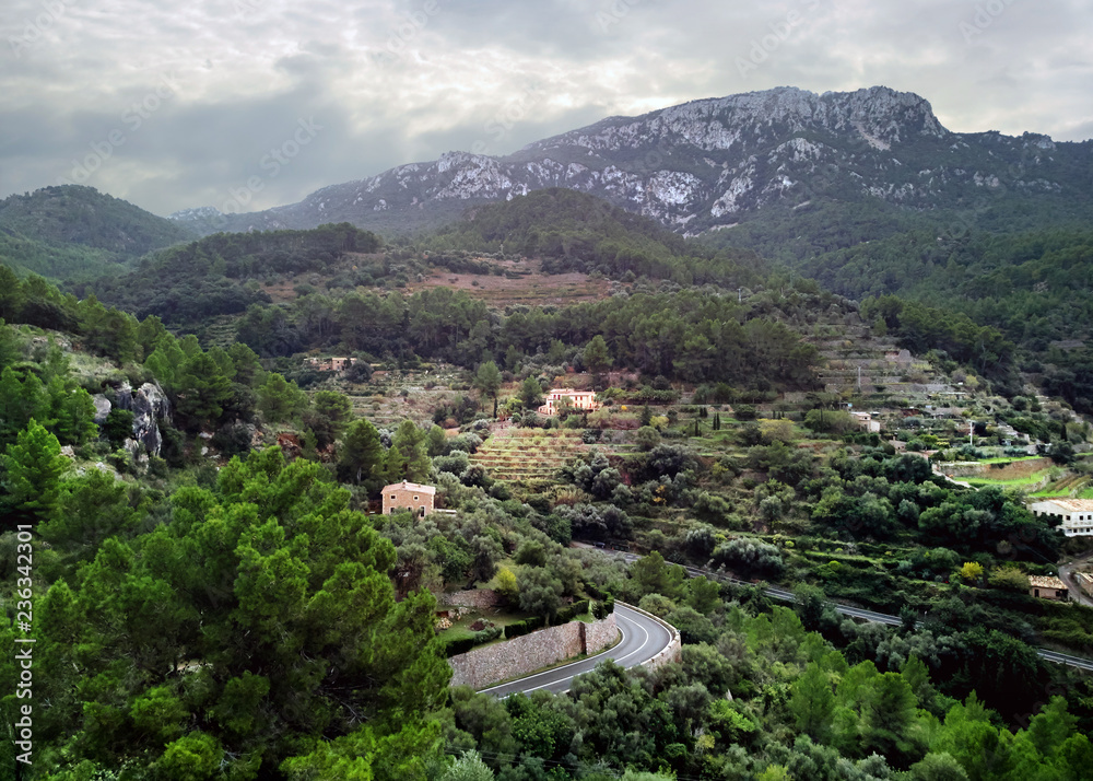 Banyalbufar town surrounded by Tramuntana mountains. Majorca, Spain