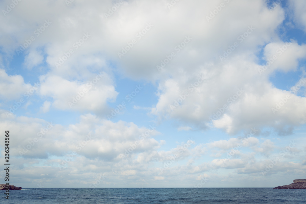 View of the sea, horizon line, clouds and blue sky. Sea water and sky horizon line