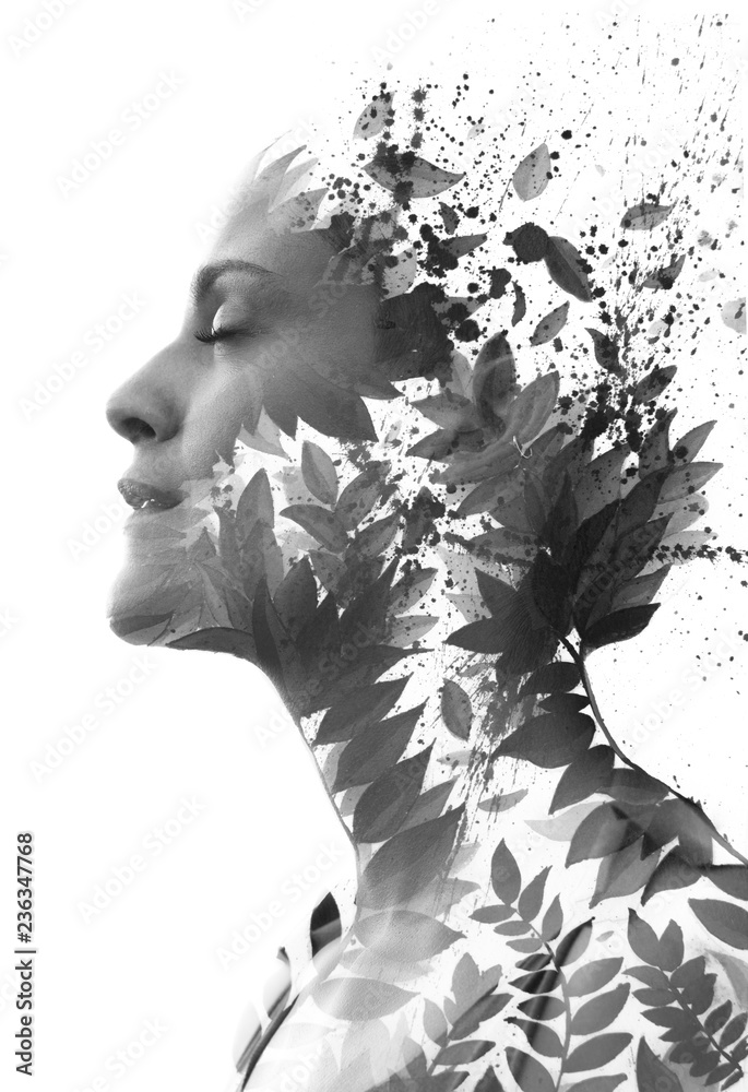 Fototapeta premium Paintography. Double Exposure portrait of an elegant woman's profile combined with hand drawn watercolor painting of leaves and ink splash, black and white