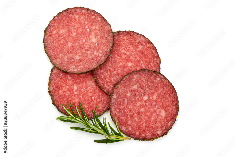 Salami sliced. Raw smoked sausage slices with herbs, isolated on a white background. Top view. Salami sliced. Raw smoked sausage slices with herbs, isolated on a white background. Top view.