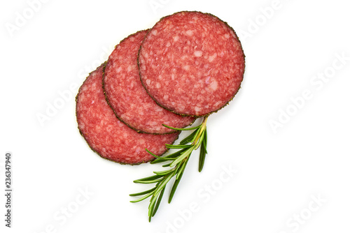 Italian salami Traditional smoked slices with herbs, isolated on a white background. Top view.