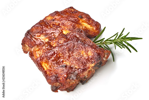 Roasted Pork Ribs with herbs, isolated on a white background. Close-up