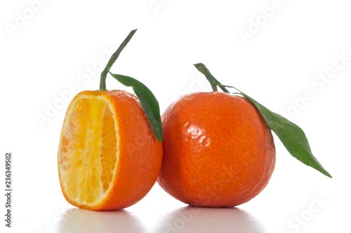 tangerines with leaves isolated on white background