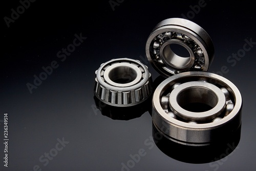 Close-up of a set of ball and roller bearings on a dark background photo