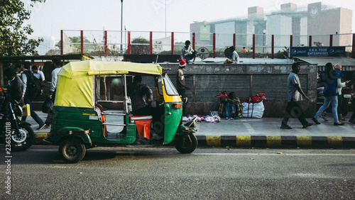 A tuk tuk parked in the street in New Delhi, India photo