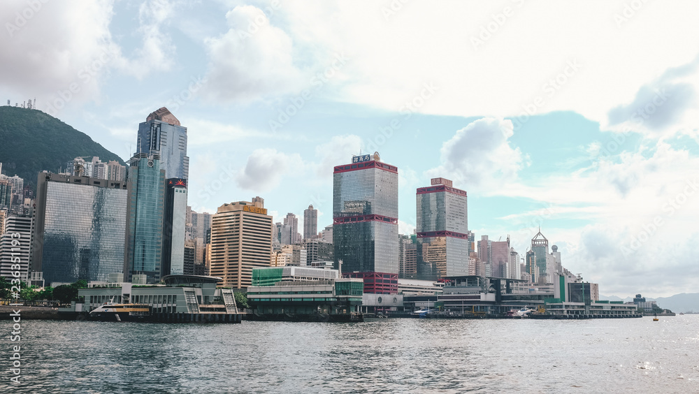 Hong Kong skyline full of skyscrapers seen from the bay on a boat Hong Kong skyline full of skyscrapers seen from the bay on a boat