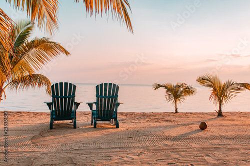 Chairs on tropical beach photo