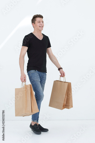 Handsome man in a black T-shirt with a bag