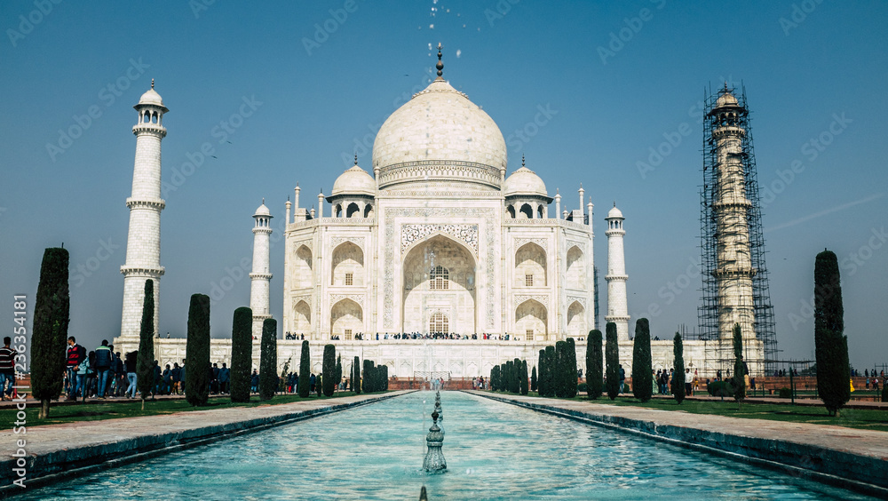 Fototapeta premium The Taj Mahal in Agra, India with scaffolding on one pillar