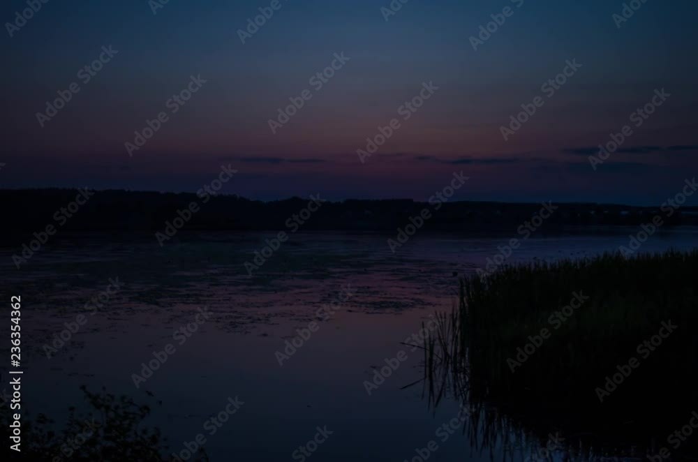 Sunset. Flying dramatic clouds over historical battles and conquests over the many centuries. Lake, summer evening. Time lapse Sunset. Flying dramatic clouds over historical battles and conquests over the many centuries. Lake, summer evening. Time lapse