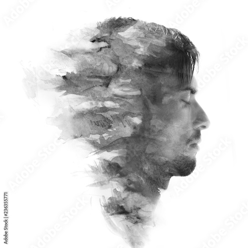 Paintography. Double exposure profile portrait of a young, attractive man combined with black and white painting