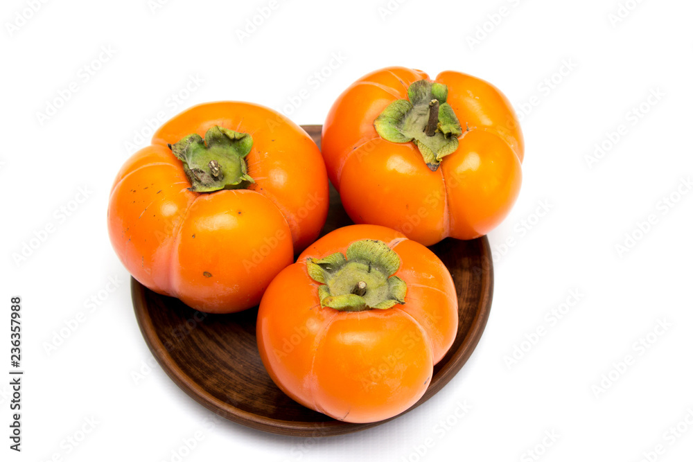 Fresh ripe persimmon, persimmon. Vitamins in the winter Fresh ripe persimmon, persimmon. Vitamins in the winter
