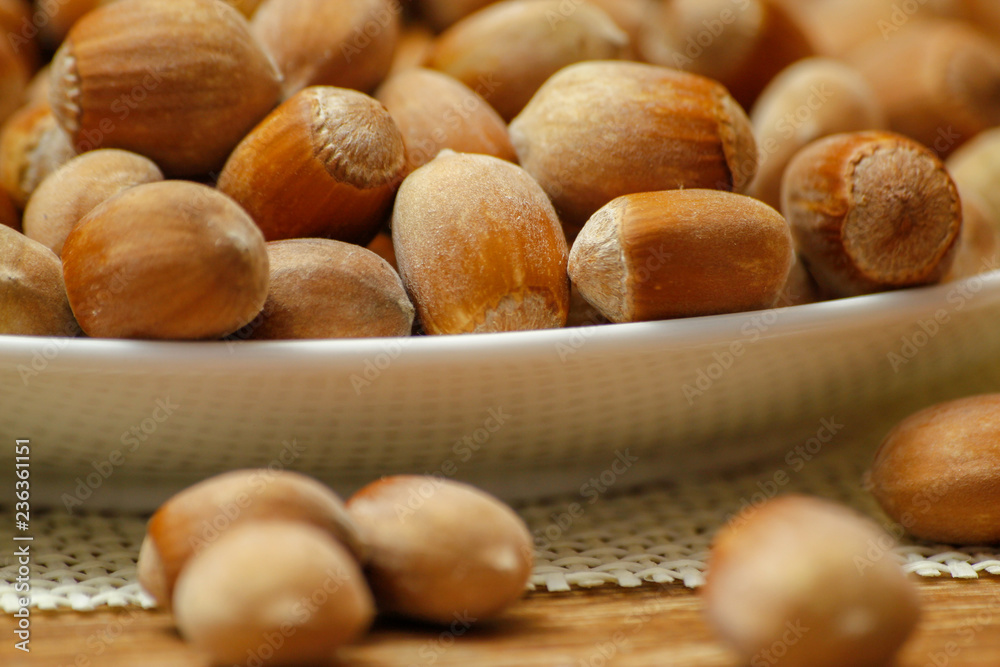 Hazelnuts on wooden table. Close-up of shelled hazelnuts. Hazelnuts on wooden table. Close-up of shelled hazelnuts.