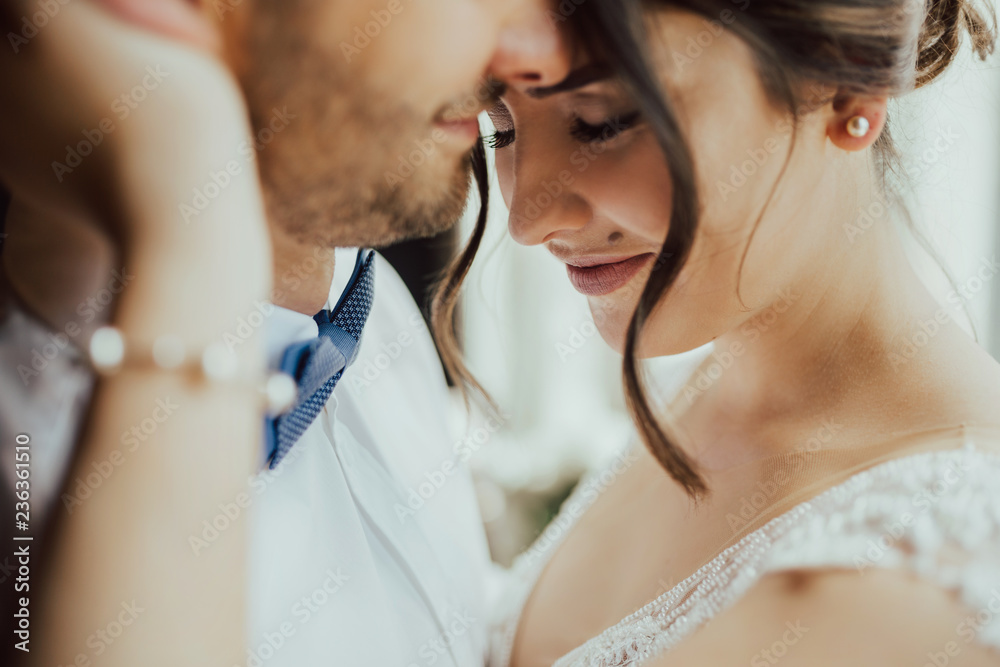 Ταπετσαρία Beautiful couple enjoying embrace of each other and tenderly smiling
