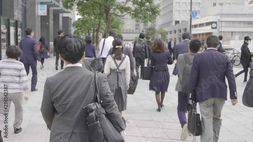 Men in business suits crossing the street in Tokyo,Japan