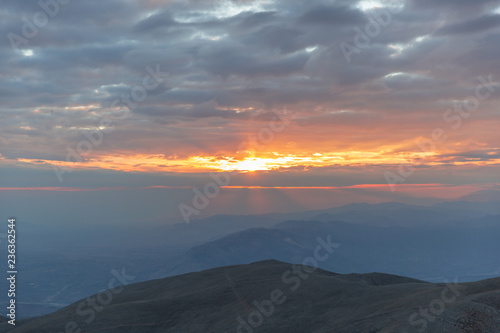 Sunset view from top of a mountain. View from Mount Nemrut, Turkey during golden hour. 