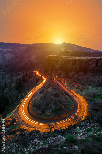 Winding Road with Car, Long Light Exposure Sunset