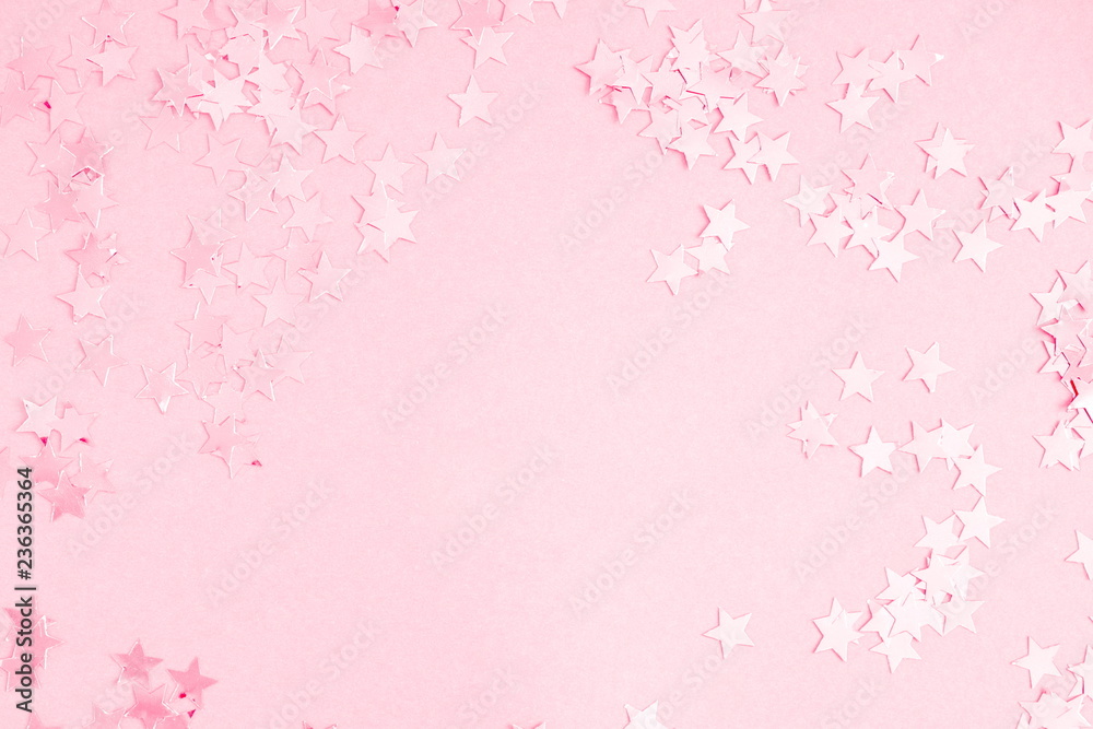 Festive pink background. Shining stars on light pink pastel background. Christmas. Wedding. Birthday. Happy woman's day. Mothers Day. Valentine's Day. Flat lay, top view, copy space.