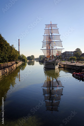 Akmena-Dane River view in Klaipeda with boats and promenade, Lithuania photo