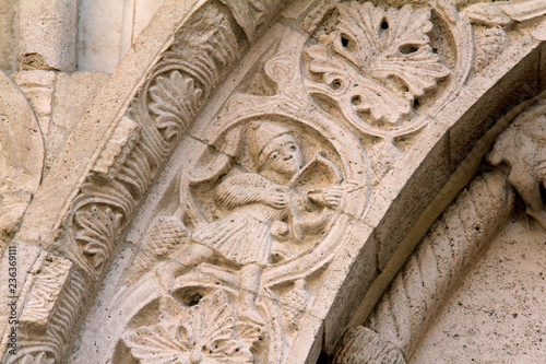 arciere; bassorilievo nella decorazione dell'arco del portale della chiesa romanica di Santa Maria della Piazza, Ancona photo