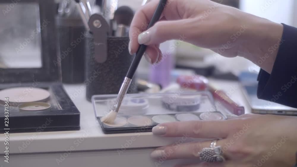 A Palette of eyeshadow with many colors. Cosmetics for Beautification, make-up concept. A Palette of eyeshadow with many colors. Cosmetics for Beautification, make-up concept.