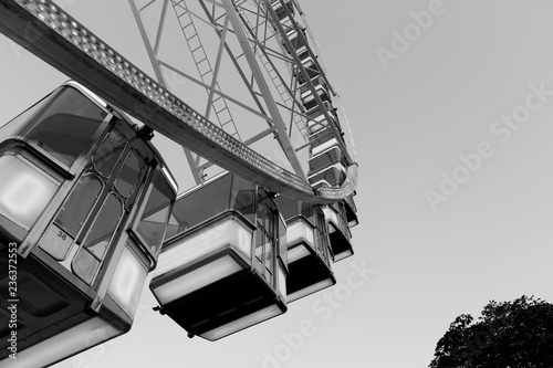 Low angle view of a ferris wheel, black and white photo