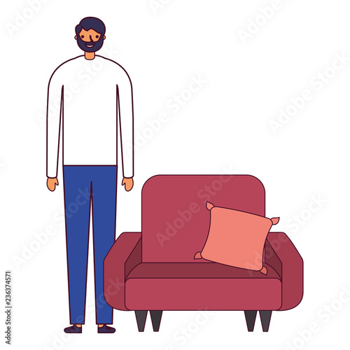 man standing near sofa with cushion