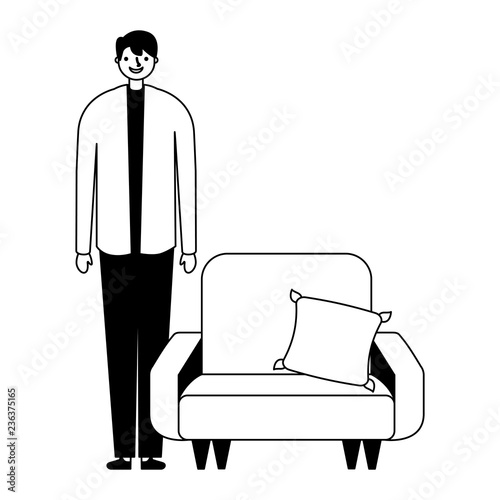 man standing near sofa with cushion