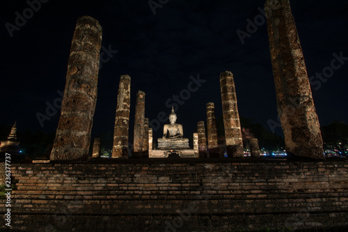 Ancient ruined Wat Mahathat in Sukhothai Historical Park at night, Sukhothai province, Thailand